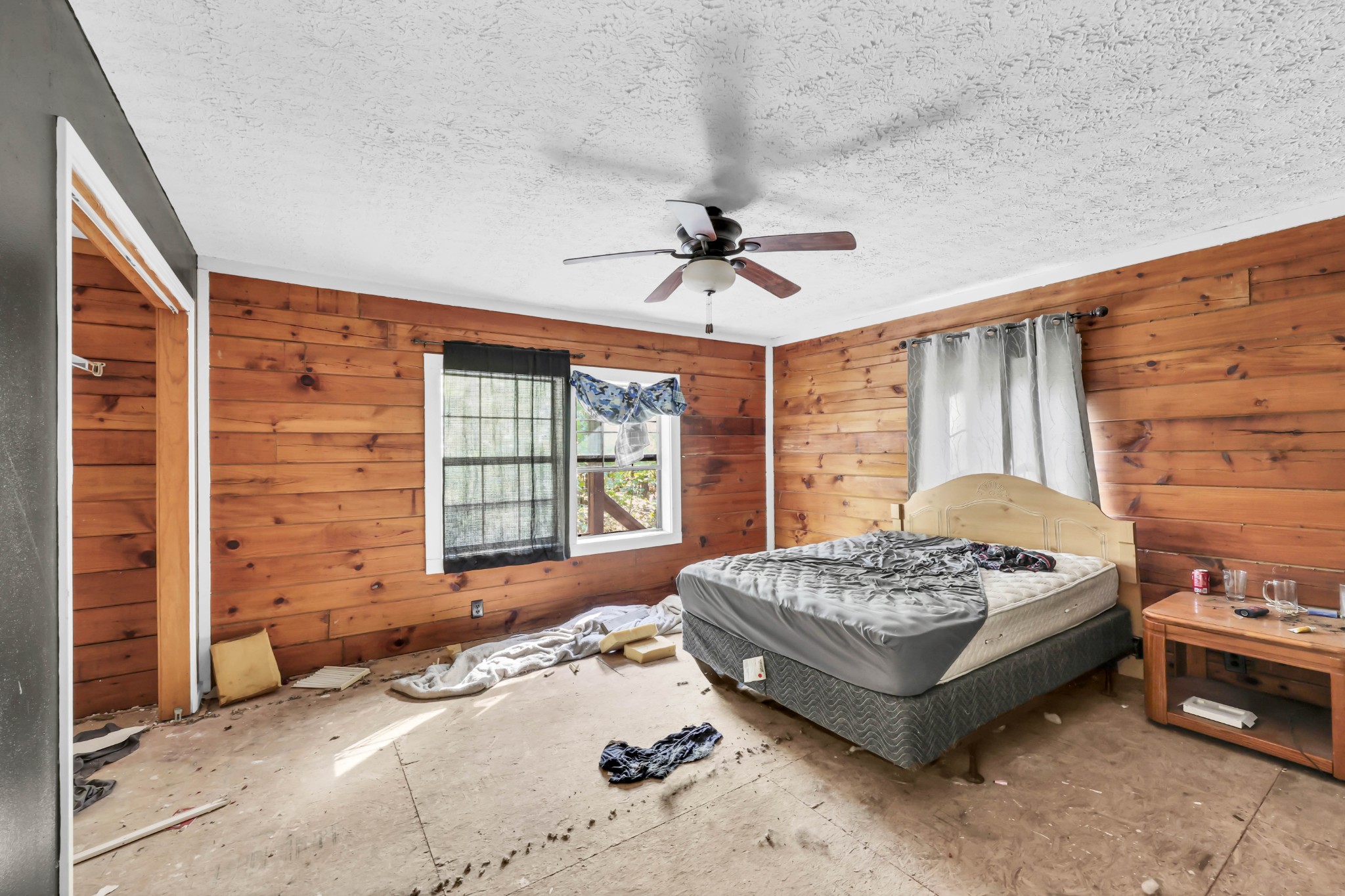 348 Shepherd Hollow Road Indian Mound, TN 37079 - Photo 21 of 23 a spacious bedroom with a bed and a chandelier