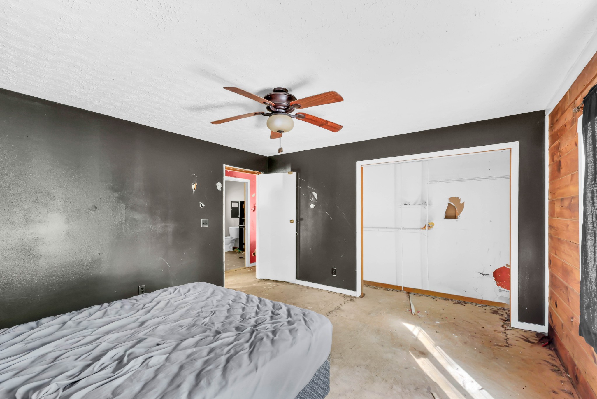 348 Shepherd Hollow Road Indian Mound, TN 37079 - Photo 23 of 23 a bedroom with a bed and a chandelier