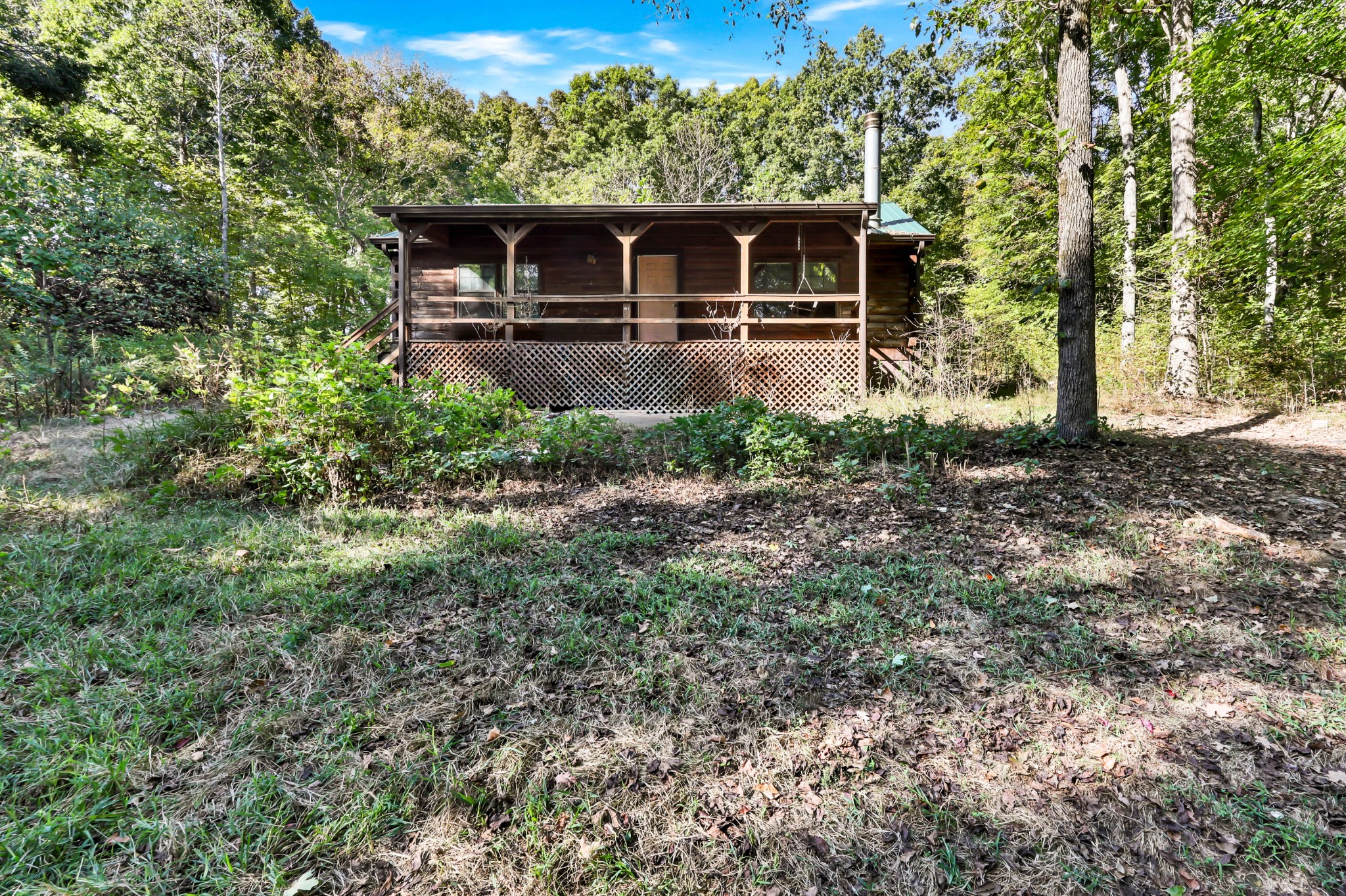 348 Shepherd Hollow Road Indian Mound, TN 37079 - Photo 5 of 23 a front view of house with yard and trees