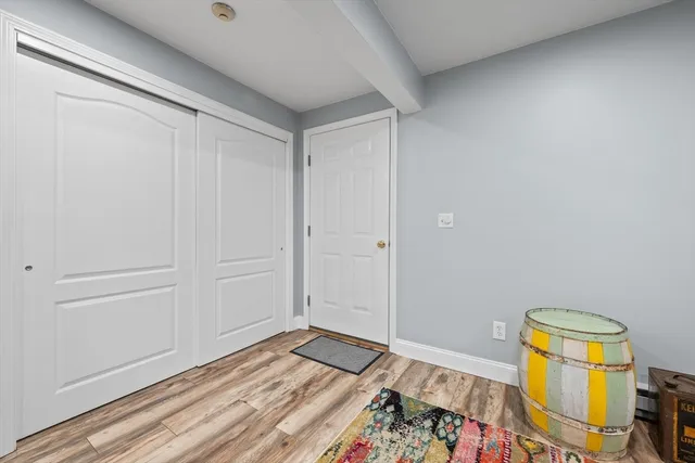 a view of room with wooden floor