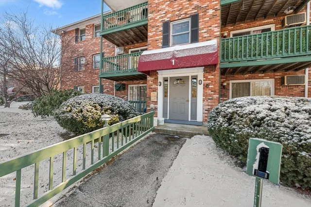 a view of a house with wooden fence