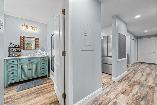 a kitchen with a refrigerator and cabinets