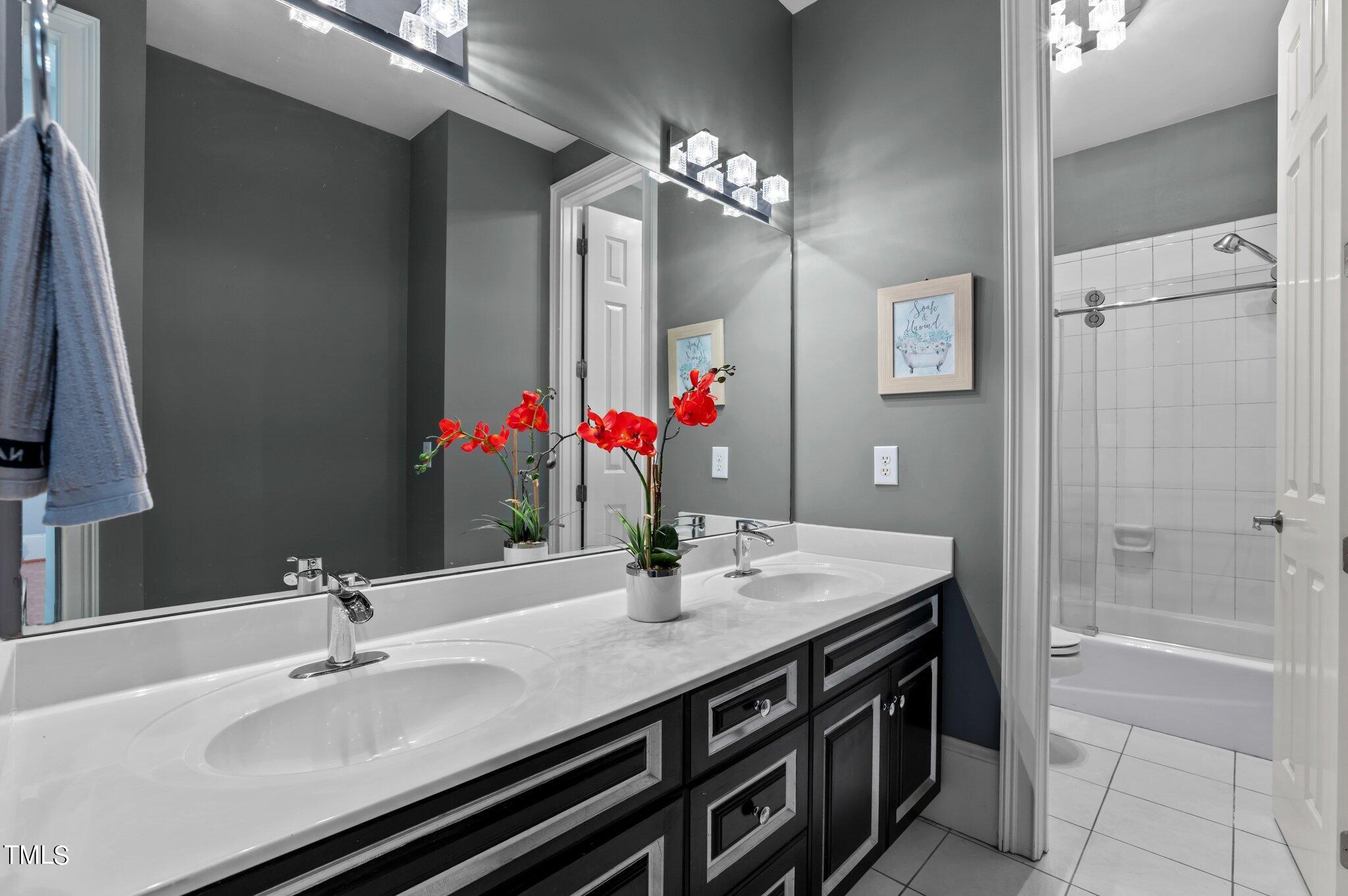 11112 Brass Kettle Road Raleigh, NC 27614 - Photo 36 of 65 a bathroom with a sink double vanity and a mirror