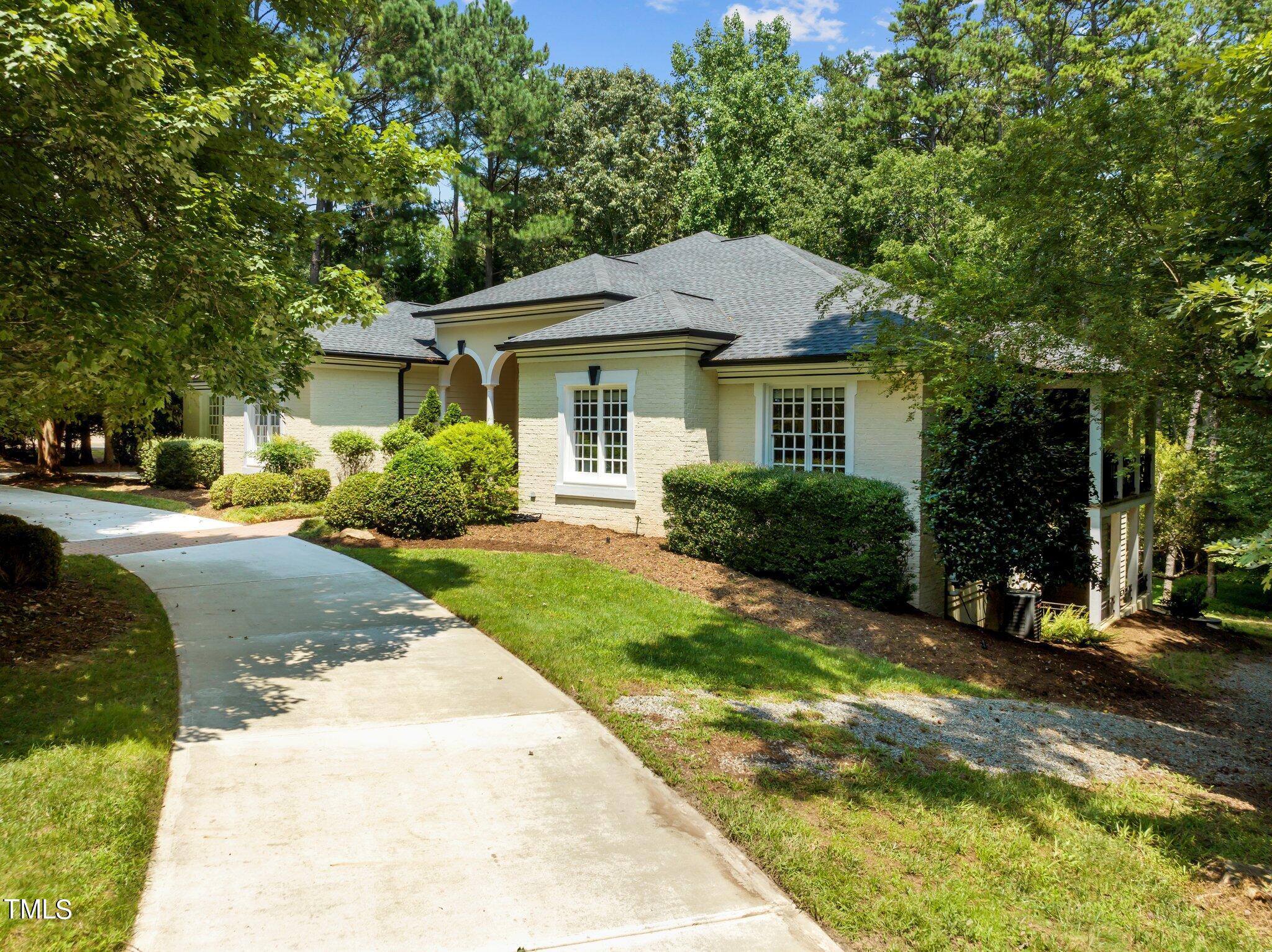 11112 Brass Kettle Road Raleigh, NC 27614 - Photo 4 of 65 a front view of a house with a yard