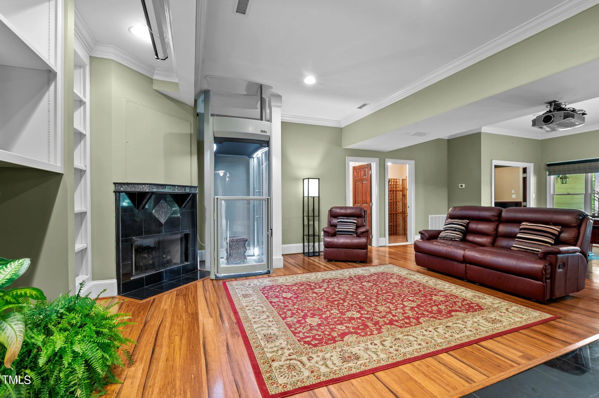 11112 Brass Kettle Road Raleigh, NC 27614 - Photo 47 of 65 a living room with a couch and a fireplace