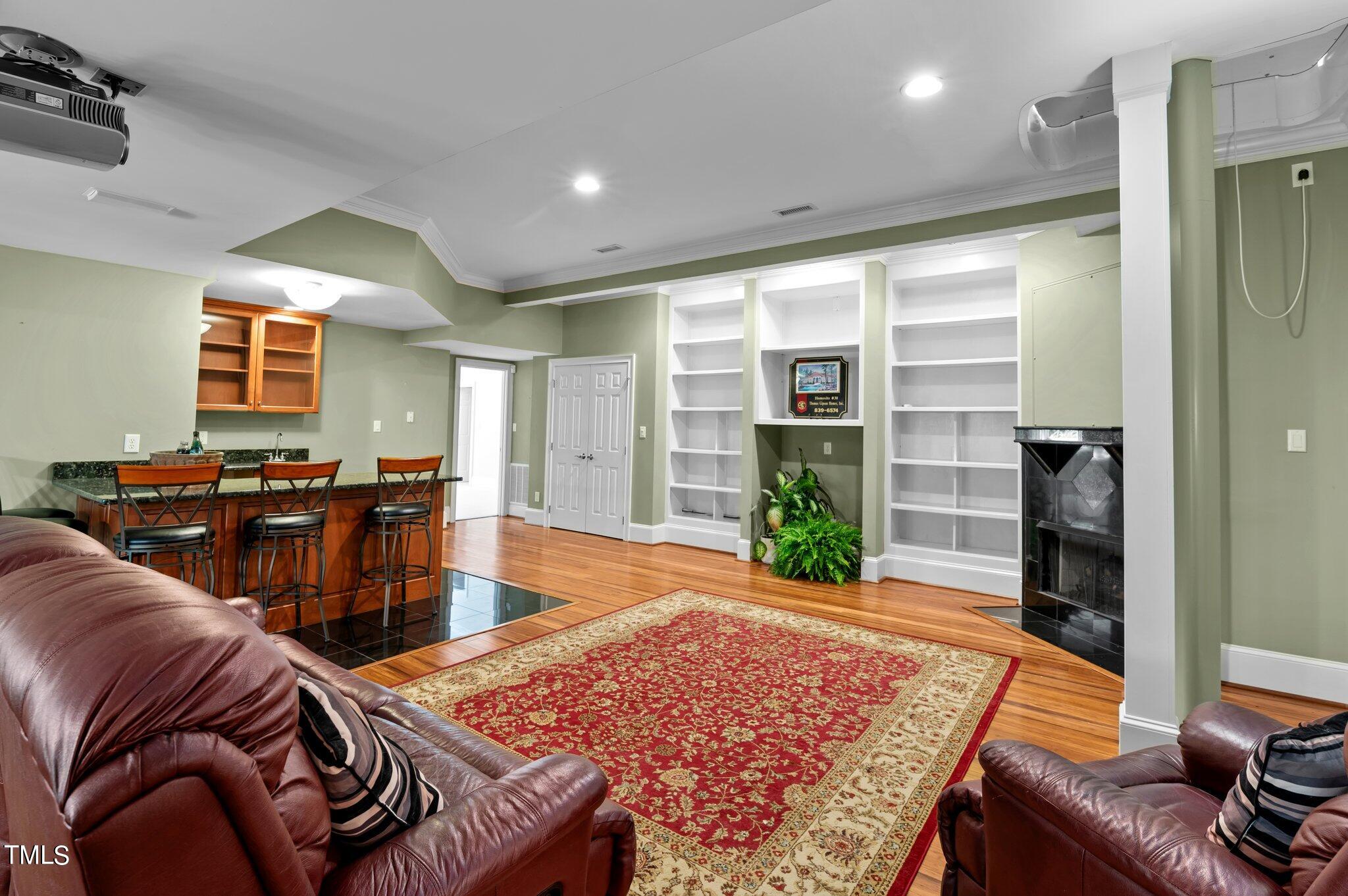 11112 Brass Kettle Road Raleigh, NC 27614 - Photo 48 of 65 a living room with furniture a rug and a window