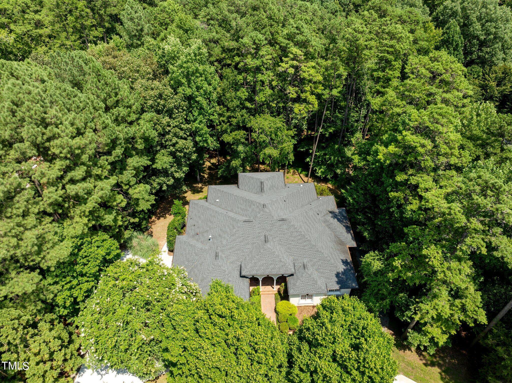 11112 Brass Kettle Road Raleigh, NC 27614 - Photo 64 of 65 an aerial view of a house with a yard and large trees