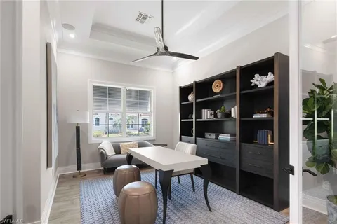a living room with furniture a rug and a window