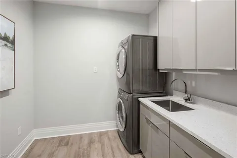 a kitchen with stainless steel appliances a refrigerator and a sink