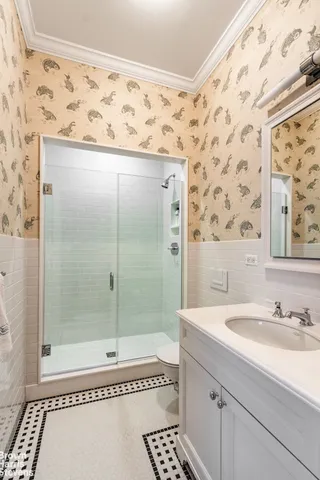 a bedroom with furniture and a flat screen tv