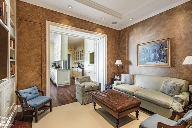 a kitchen with a sink stove and wooden floor