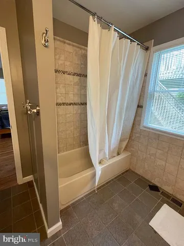 a view of walk in closet with window