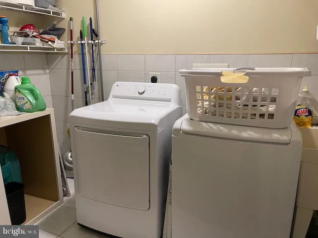 a utility room with dryer and washer