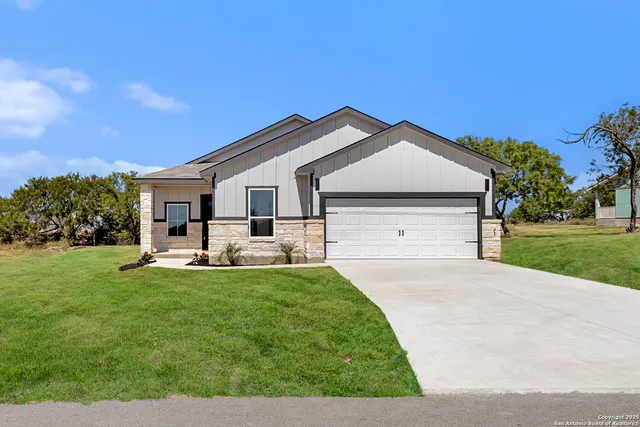 a front view of a house with patio