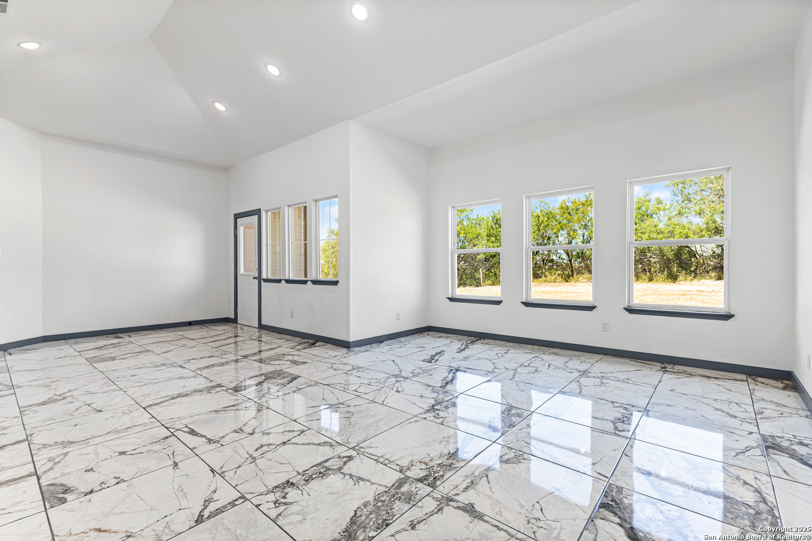 133 Flor Del Sol Road San Antonio, TX 78264 - Photo 13 of 28 a view of an empty room and window