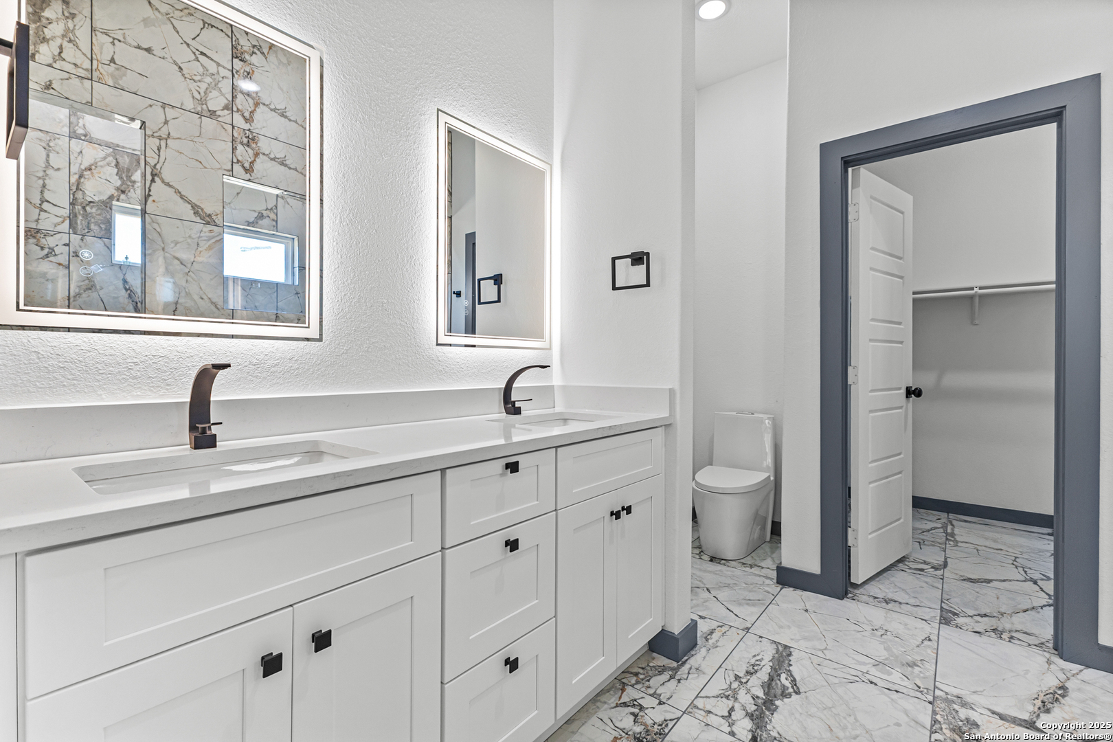133 Flor Del Sol Road San Antonio, TX 78264 - Photo 15 of 28 a spacious bathroom with double sink and mirror