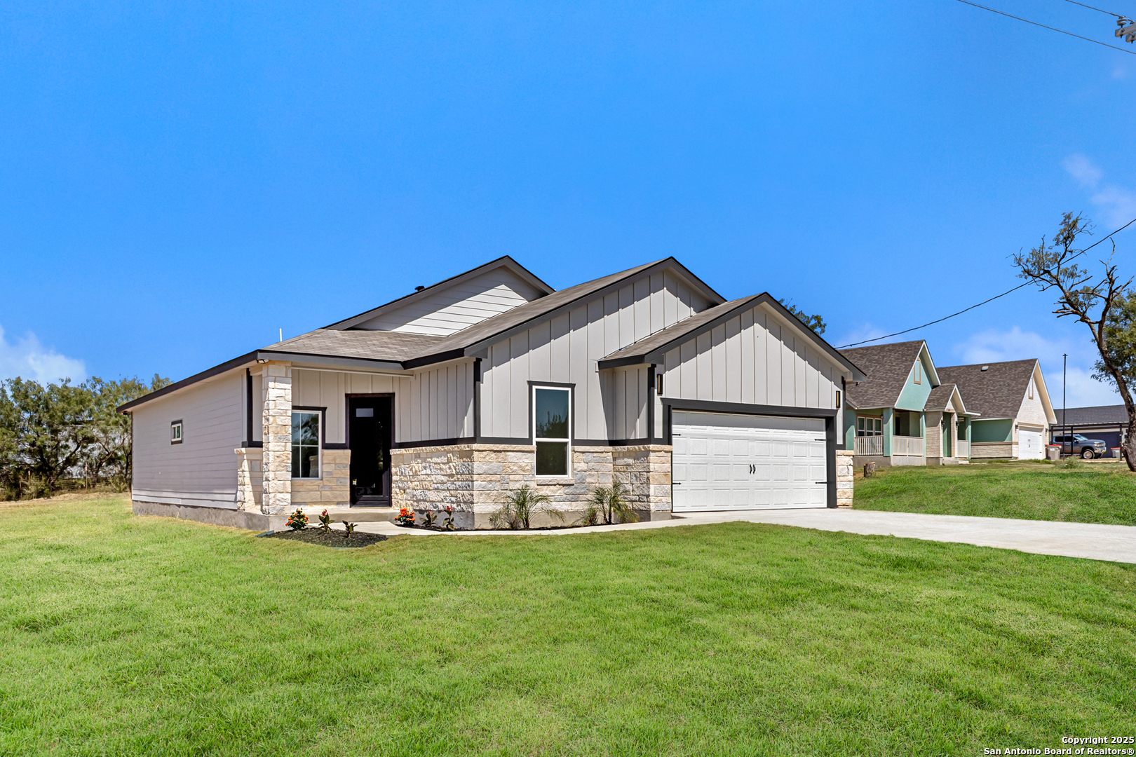 133 Flor Del Sol Road San Antonio, TX 78264 - Photo 2 of 28 a front view of house with yard and green space