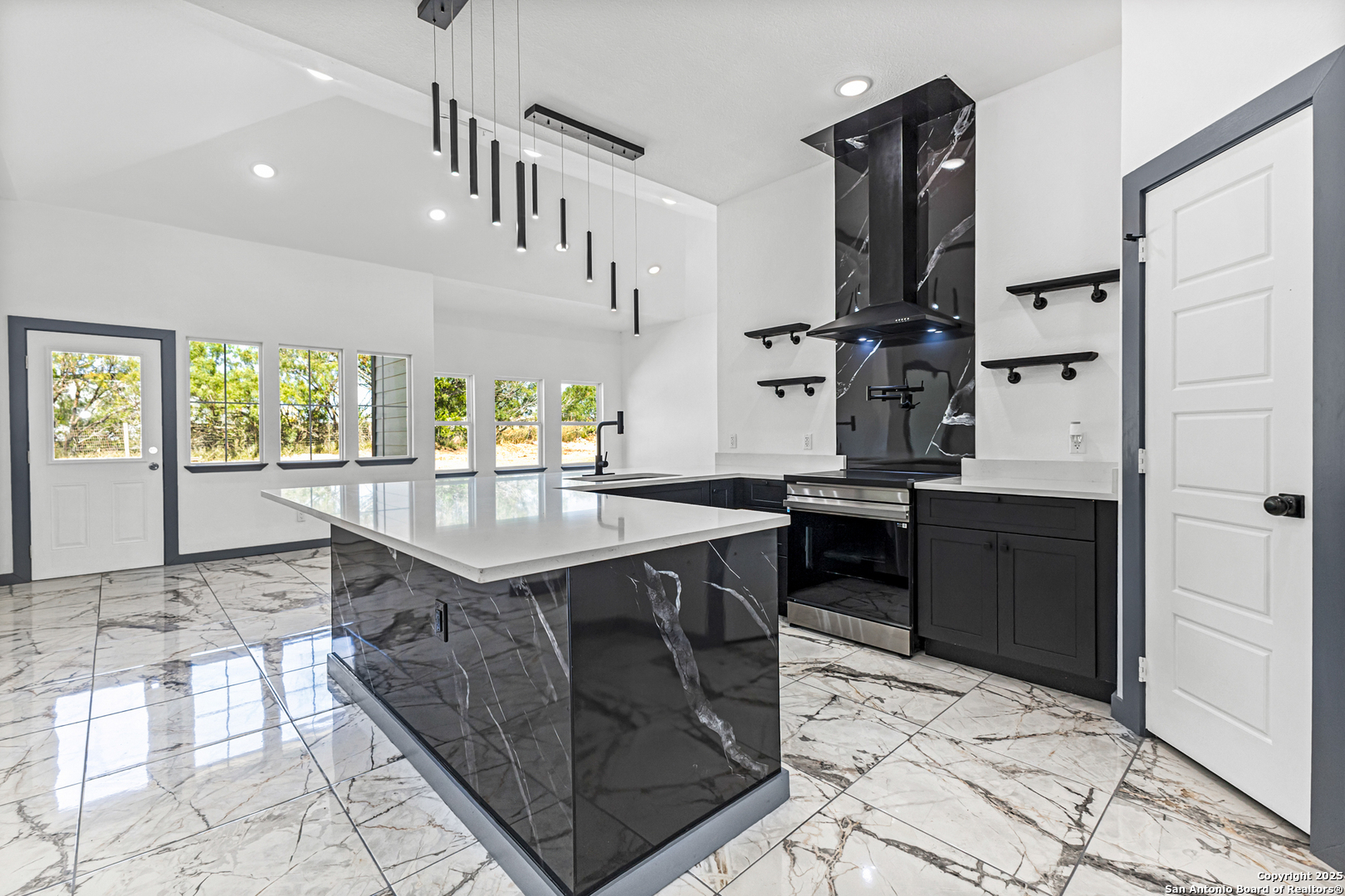 133 Flor Del Sol Road San Antonio, TX 78264 - Photo 6 of 28 a kitchen with stainless steel appliances granite countertop a sink stove and cabinets