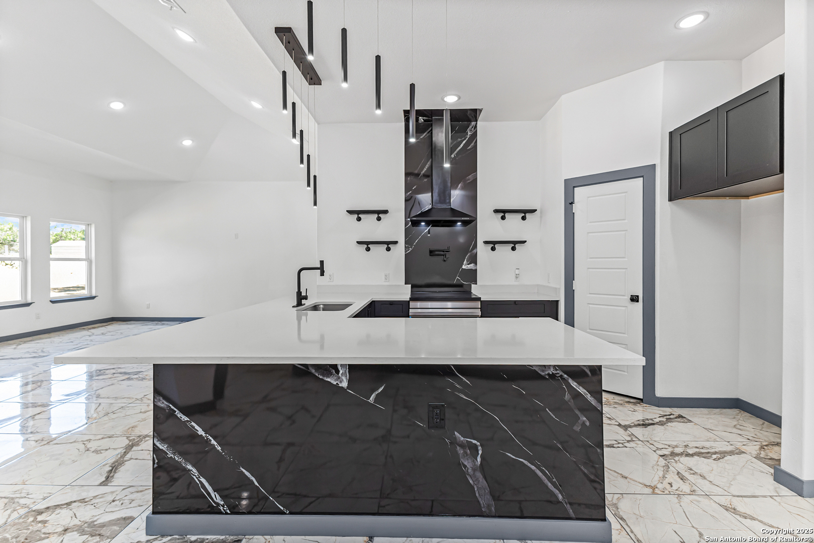 133 Flor Del Sol Road San Antonio, TX 78264 - Photo 8 of 28 a kitchen with stainless steel appliances kitchen island granite countertop a refrigerator and a sink