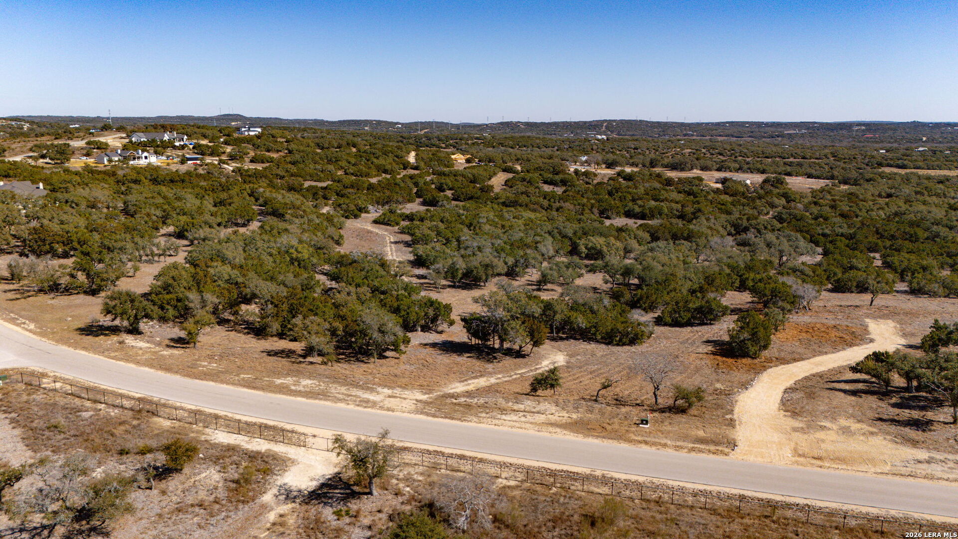 1201 Brewer Rdg Road Bulverde, TX 78163 - Photo 1 of 21 an aerial view of a house with a yard and city view