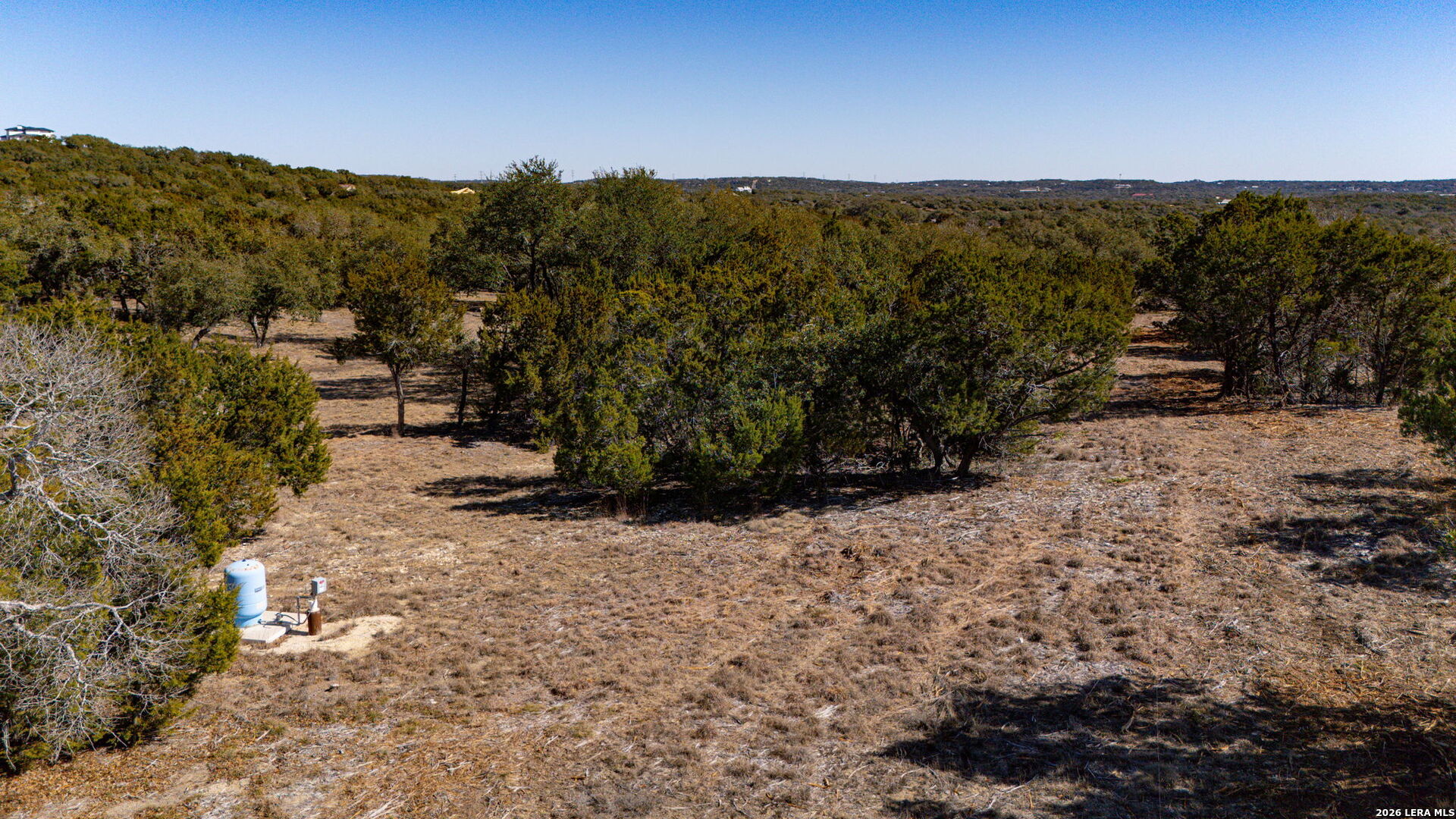 1201 Brewer Rdg Road Bulverde, TX 78163 - Photo 12 of 21 a view of a road with wooden fence