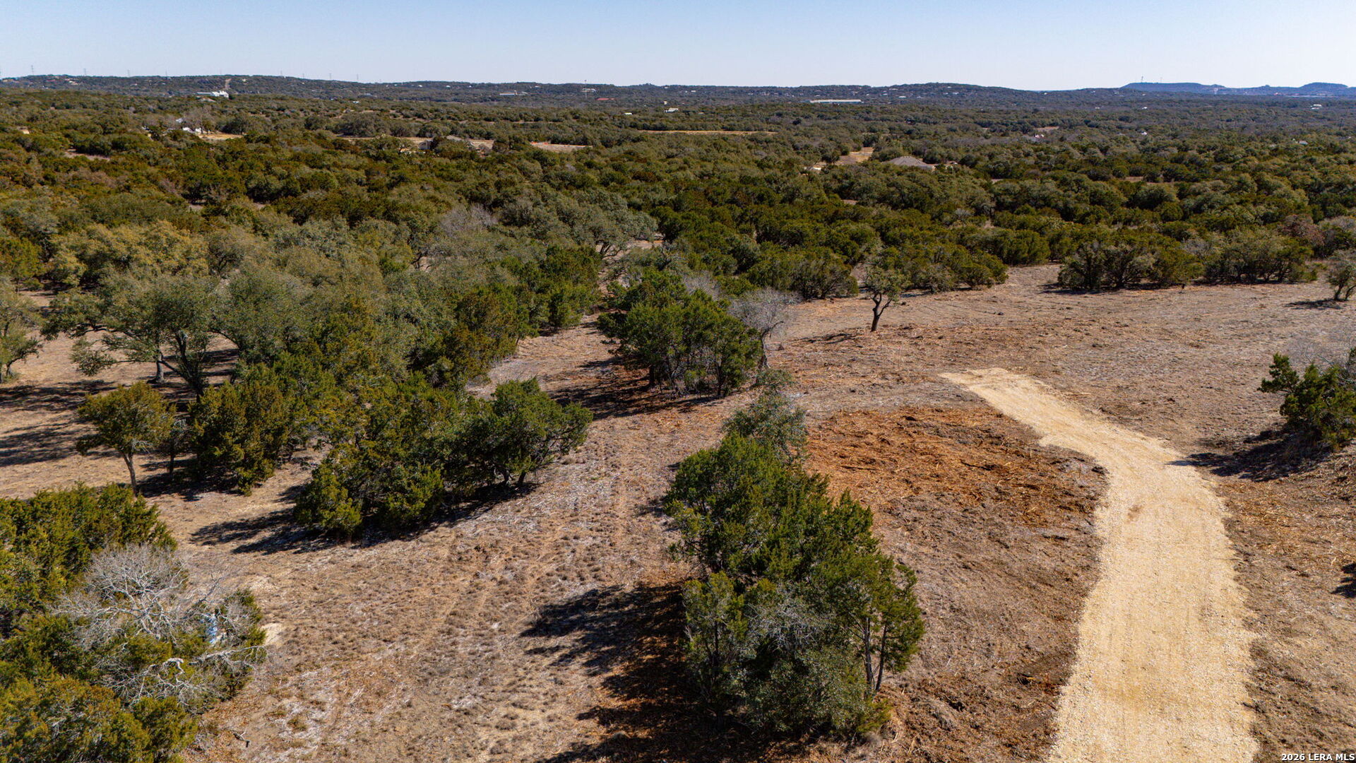 1201 Brewer Rdg Road Bulverde, TX 78163 - Photo 10 of 21 a view of a yard with a mountain