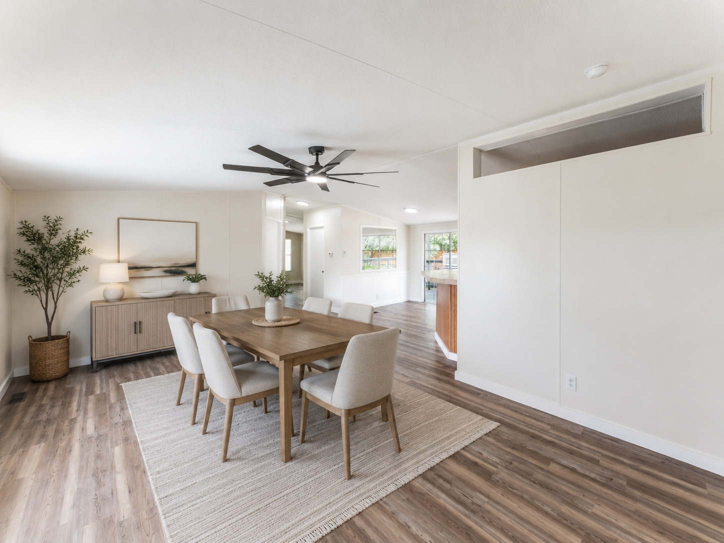 171 Railyard Drive Kyle, TX 78640 - Photo 20 of 20 a view of a dining room with furniture and a wooden floor