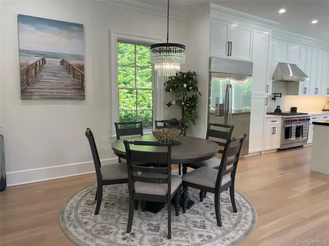 a bathroom with a sink vanity and a toilet