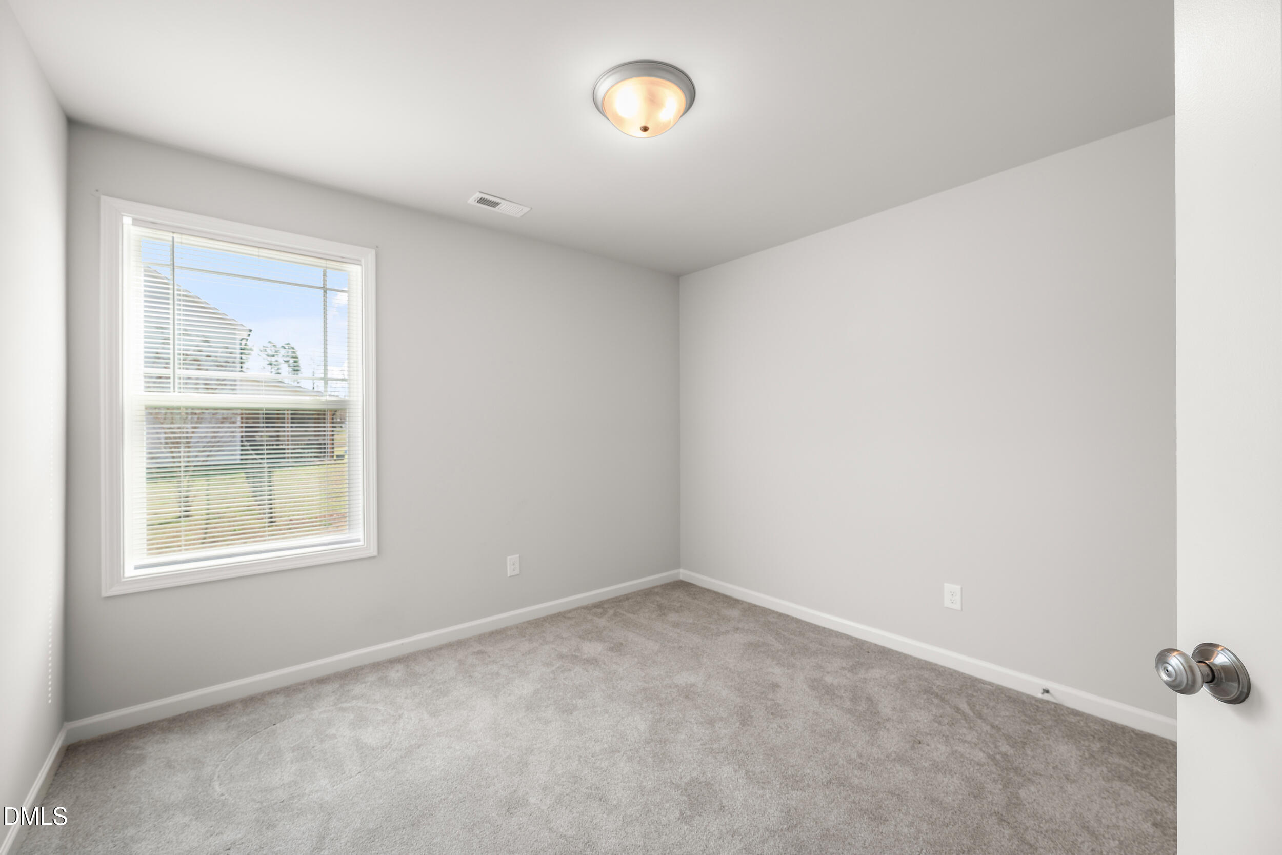67 Dale Ridge Drive Princeton, NC 27569 - Photo 12 of 22 an empty room with a window