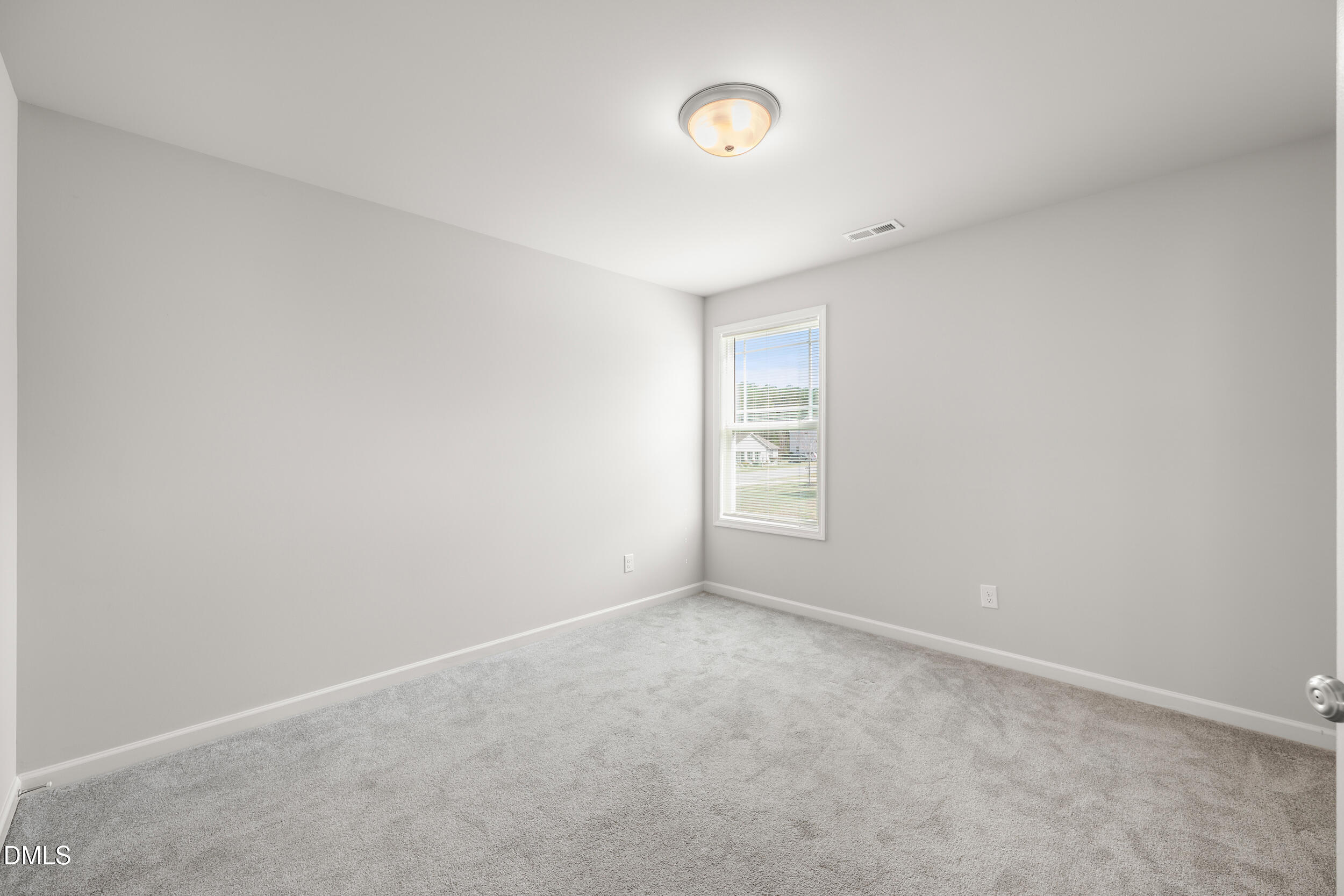 67 Dale Ridge Drive Princeton, NC 27569 - Photo 13 of 22 an empty room with windows