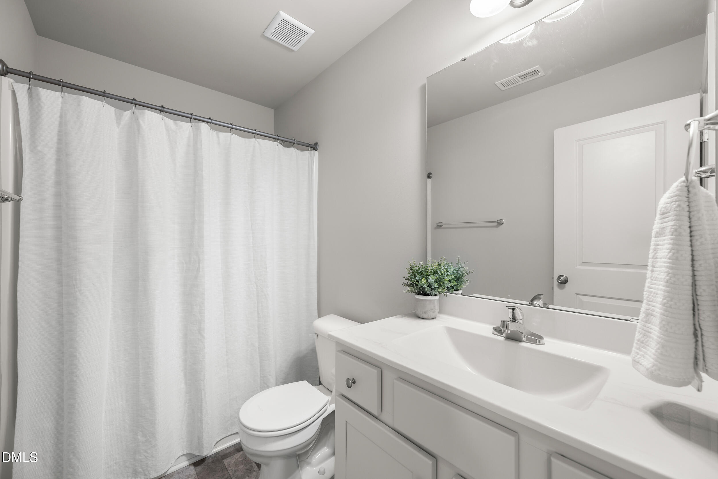 67 Dale Ridge Drive Princeton, NC 27569 - Photo 14 of 22 a bathroom with a sink a toilet and a mirror