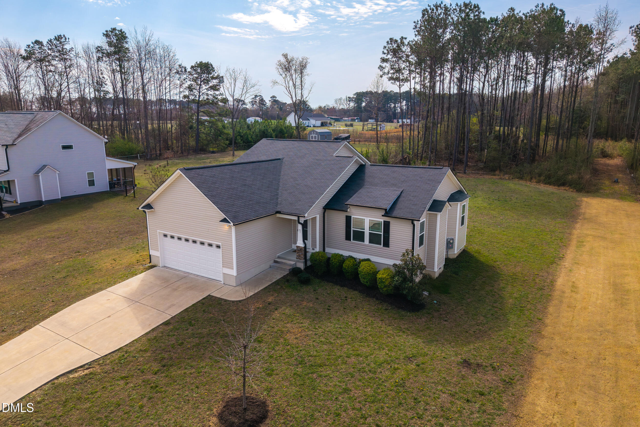 67 Dale Ridge Drive Princeton, NC 27569 - Photo 18 of 22 a aerial view of a house with swimming pool and a yard