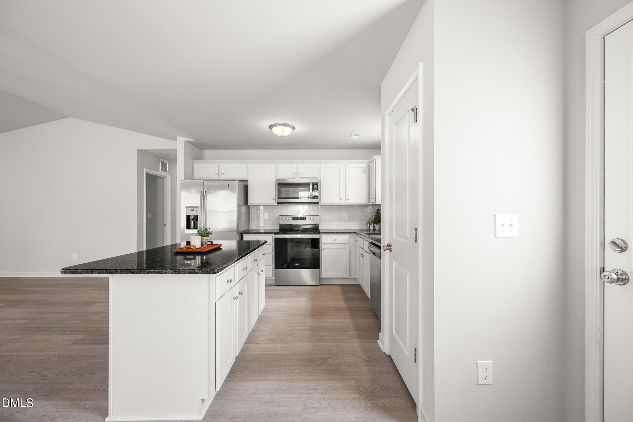 67 Dale Ridge Drive Princeton, NC 27569 - Photo 7 of 22 a kitchen with stainless steel appliances a sink stove and refrigerator