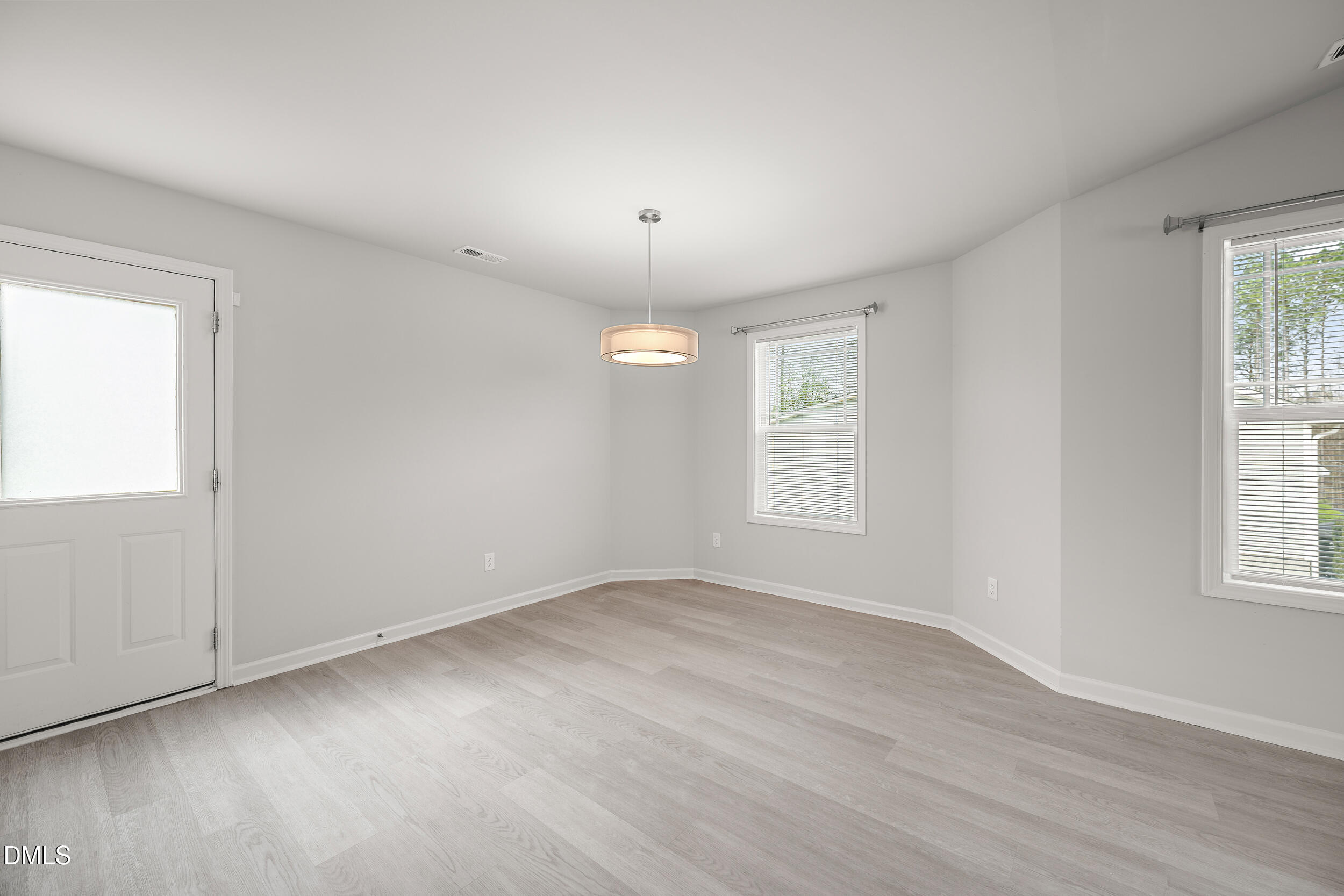 67 Dale Ridge Drive Princeton, NC 27569 - Photo 8 of 22 wooden floor in an empty room with a window