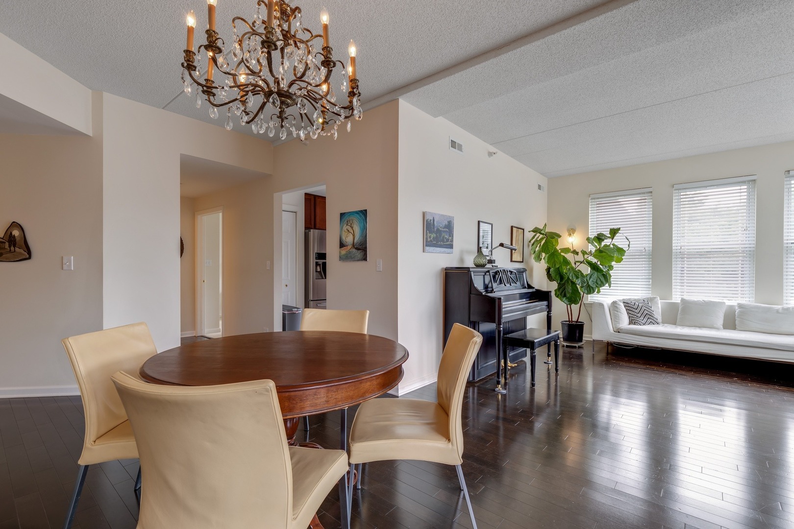 2935 Central Street, Unit 204 Evanston, IL 60201 - Photo 11 of 29 a dining room with furniture potted plants and wooden floor