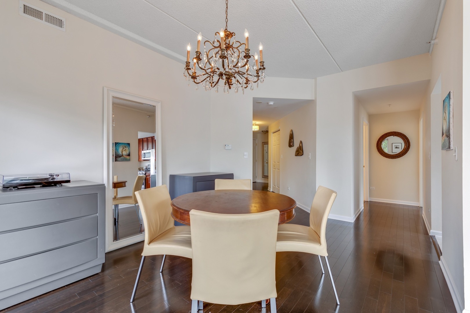 2935 Central Street, Unit 204 Evanston, IL 60201 - Photo 12 of 29 a view of a dining room with furniture and chandelier