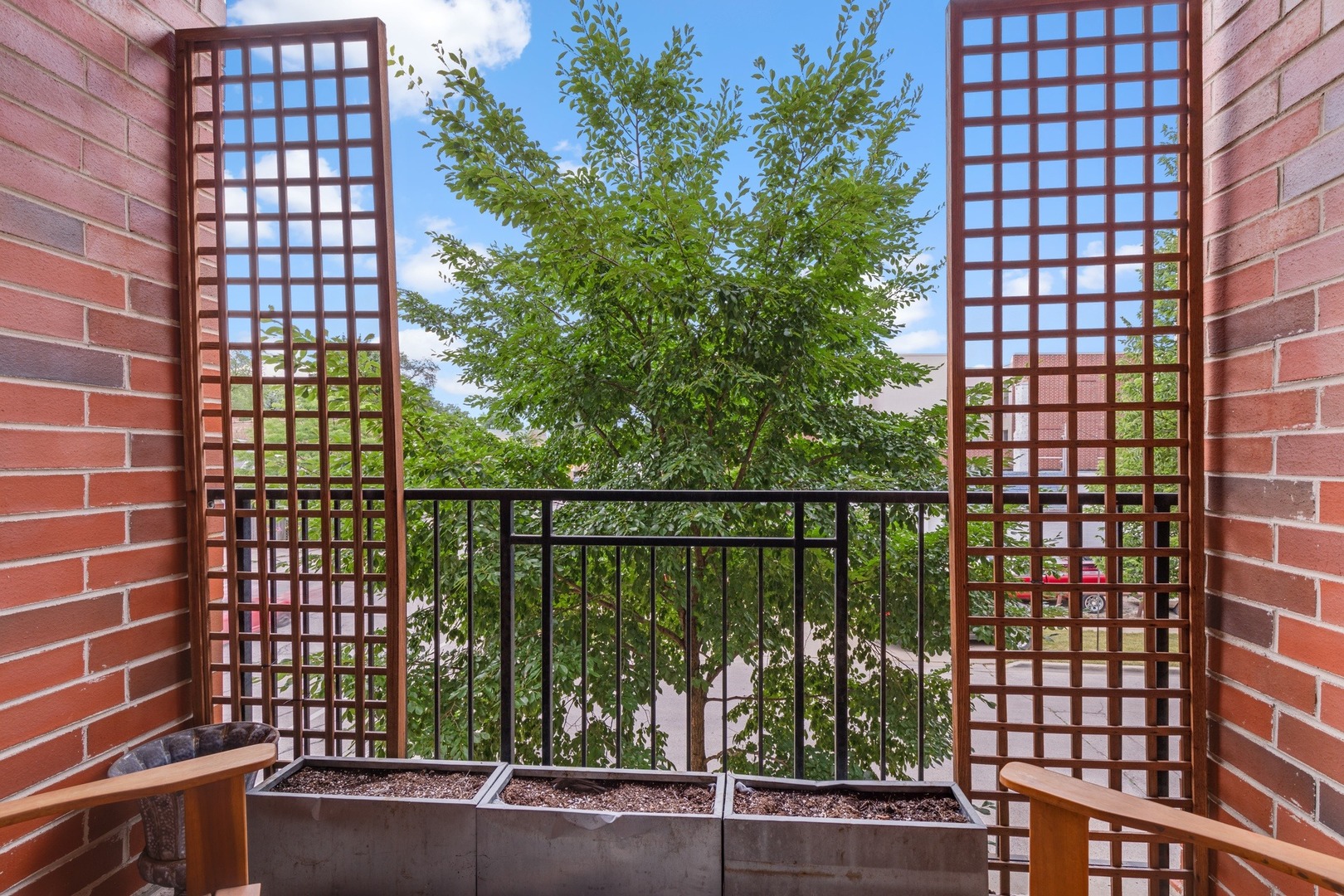 2935 Central Street, Unit 204 Evanston, IL 60201 - Photo 14 of 29 a view of a balcony with a floor to ceiling window next to a city view