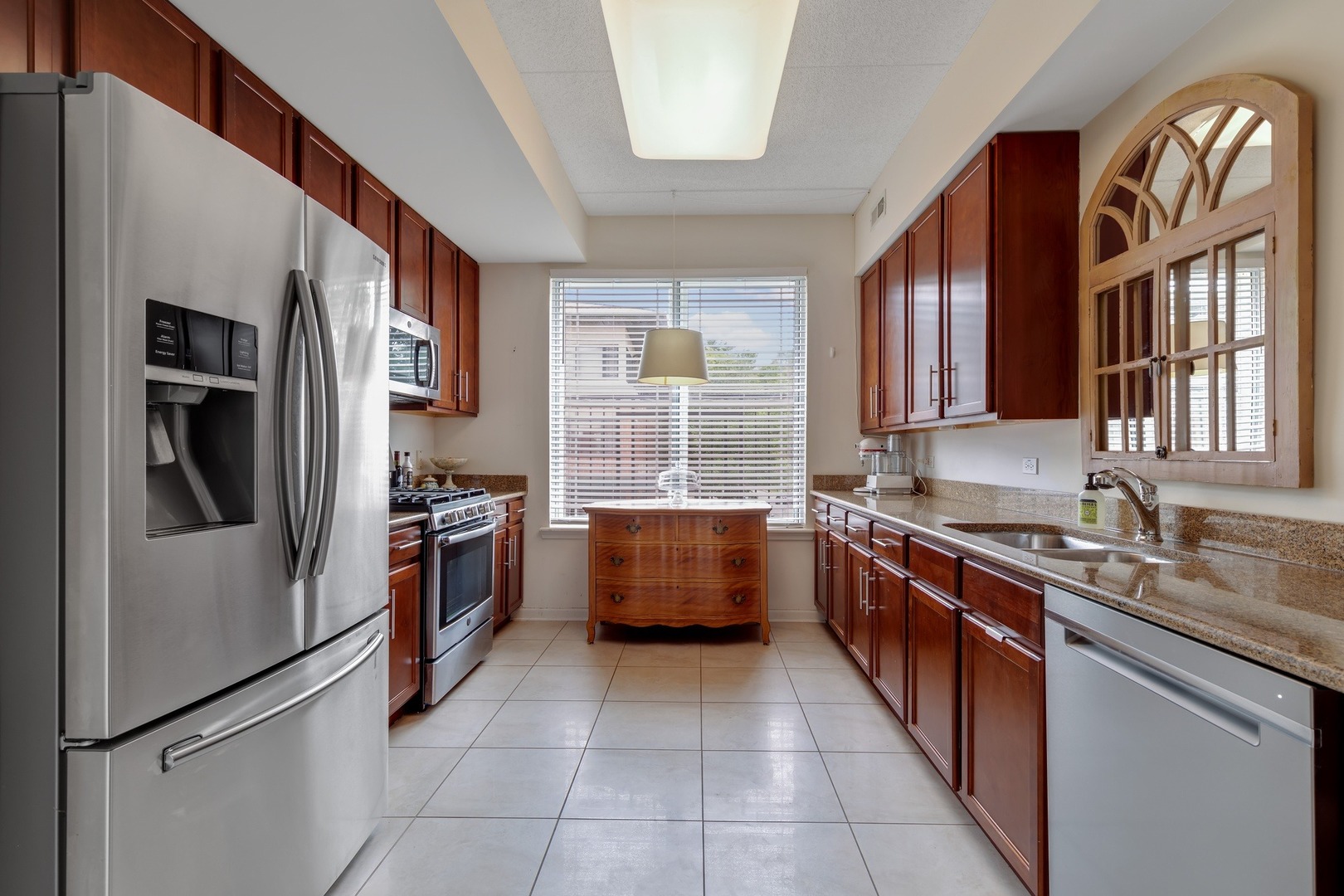 2935 Central Street, Unit 204 Evanston, IL 60201 - Photo 16 of 29 a kitchen with stainless steel appliances granite countertop a sink stove and refrigerator