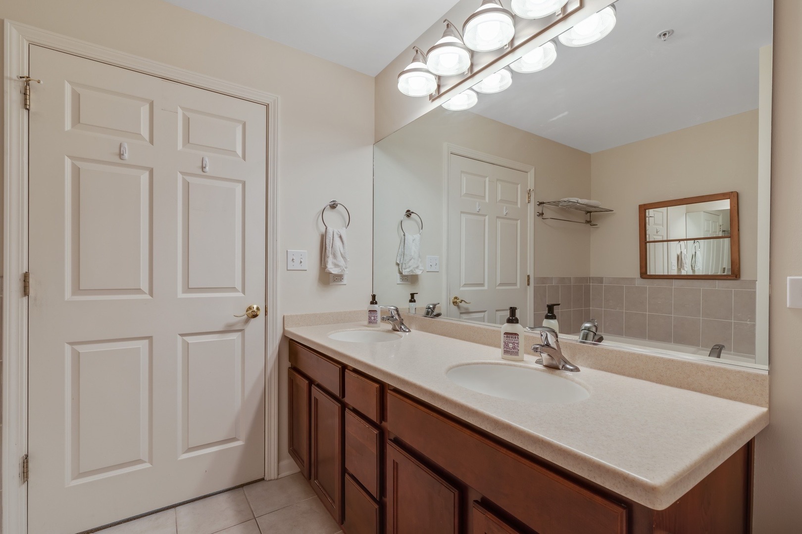 2935 Central Street, Unit 204 Evanston, IL 60201 - Photo 21 of 29 a bathroom with a sink a light fixture and a mirror