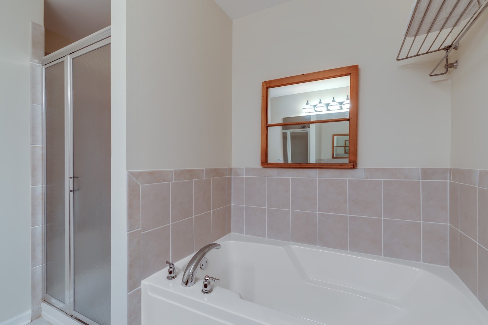 2935 Central Street, Unit 204 Evanston, IL 60201 - Photo 22 of 29 a white bath tub sitting next to a window