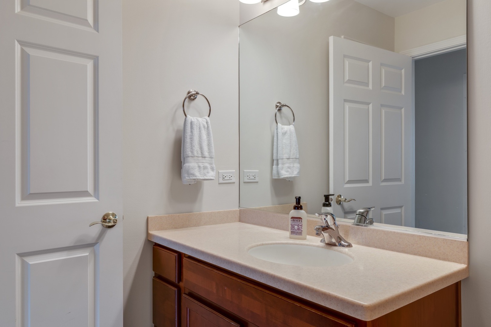 2935 Central Street, Unit 204 Evanston, IL 60201 - Photo 25 of 29 a bathroom with a sink and a mirror