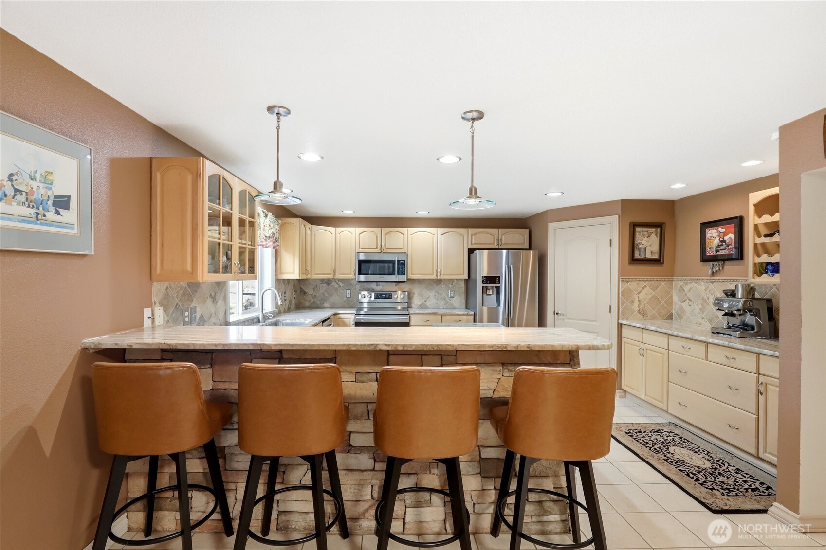 21 East Michelle Court Union, WA 98592 - Photo 5 of 33 a dining table seating chairs and white kitchen