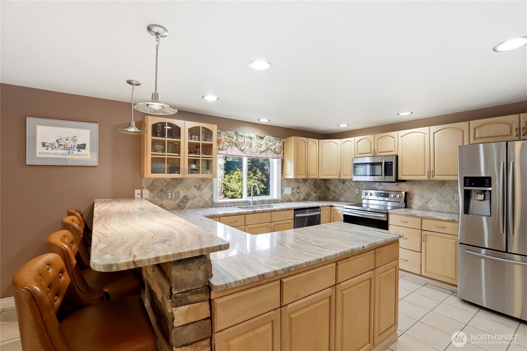21 East Michelle Court Union, WA 98592 - Photo 6 of 33 a kitchen with stainless steel appliances granite countertop a stove refrigerator sink and cabinets