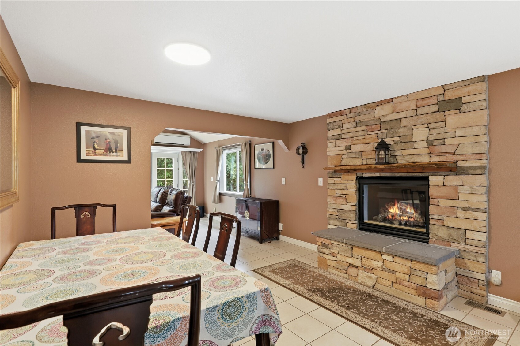 21 East Michelle Court Union, WA 98592 - Photo 7 of 33 a living room with furniture a fireplace and a table