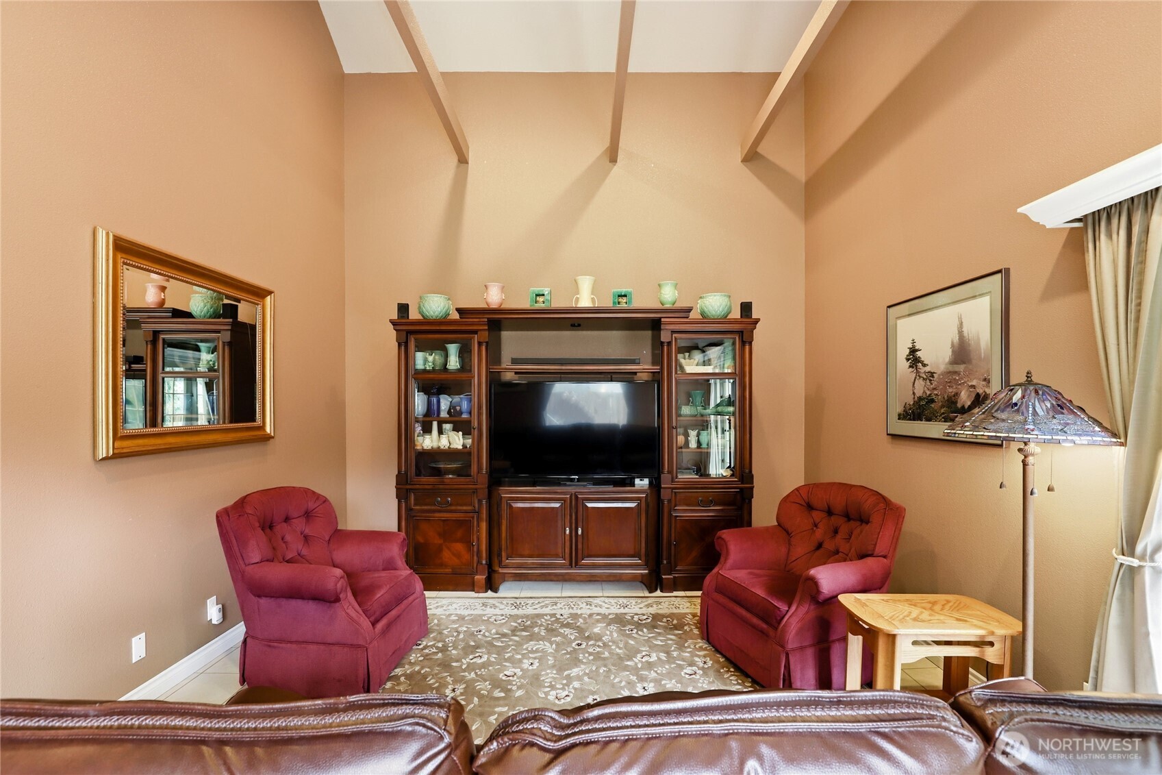 21 East Michelle Court Union, WA 98592 - Photo 10 of 33 a living room with furniture a flat screen tv and paintings on the wall