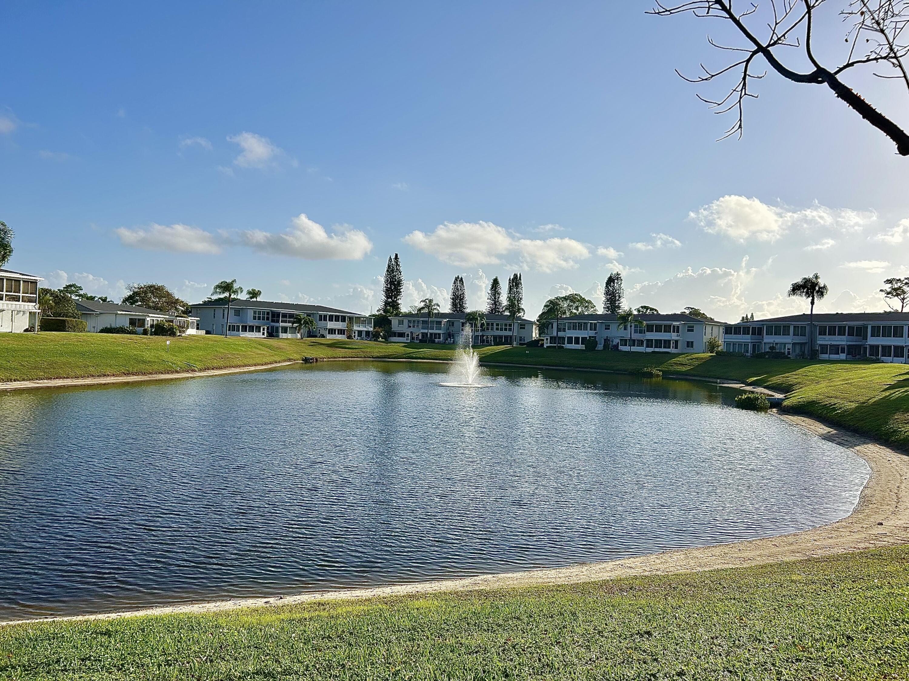 a view of a lake with houses in the background