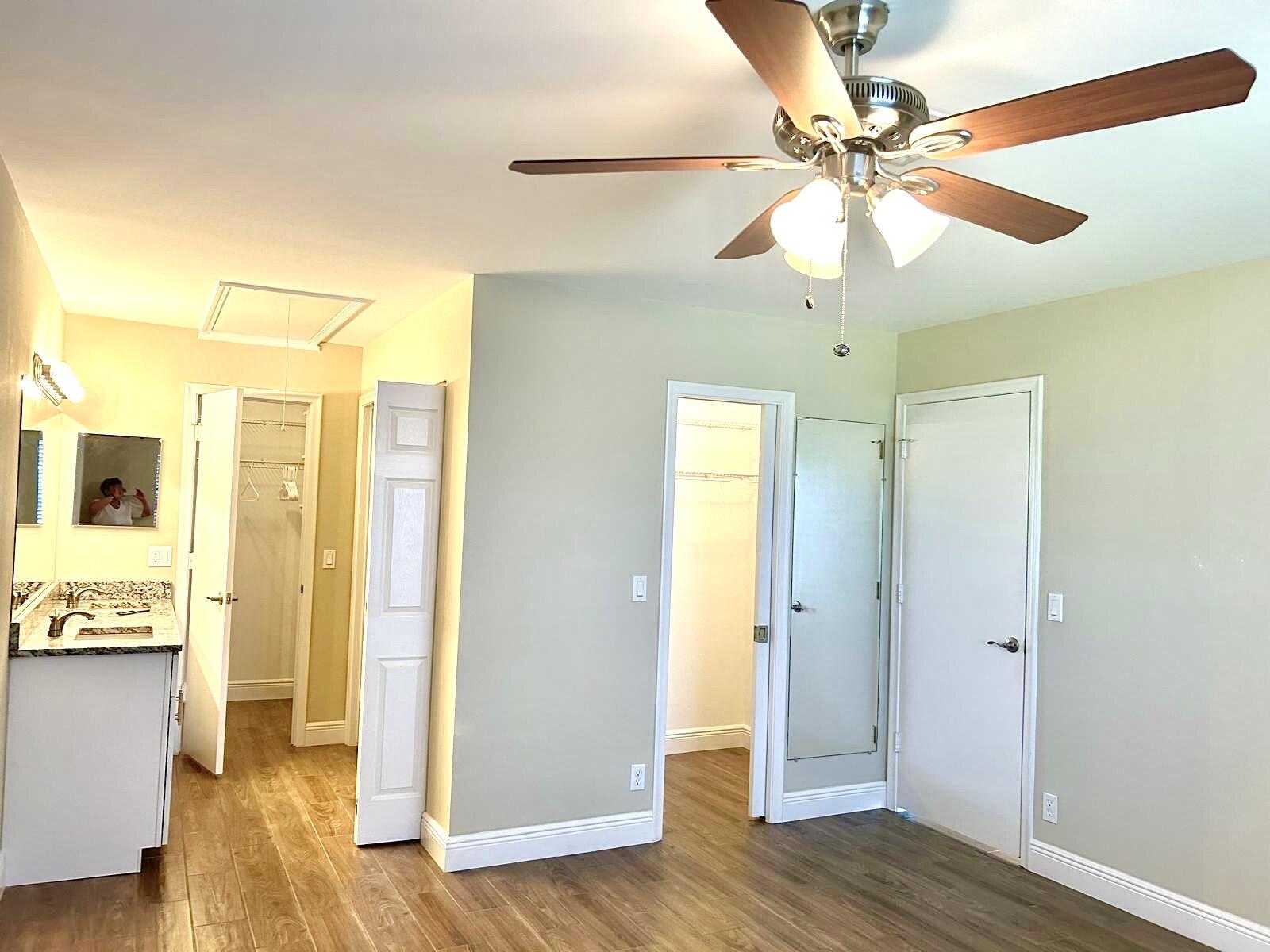 2811 Southwest 15th Street, Unit 202 Delray Beach, FL 33445 - Photo 14 of 21 a view of a hallway with wooden floor