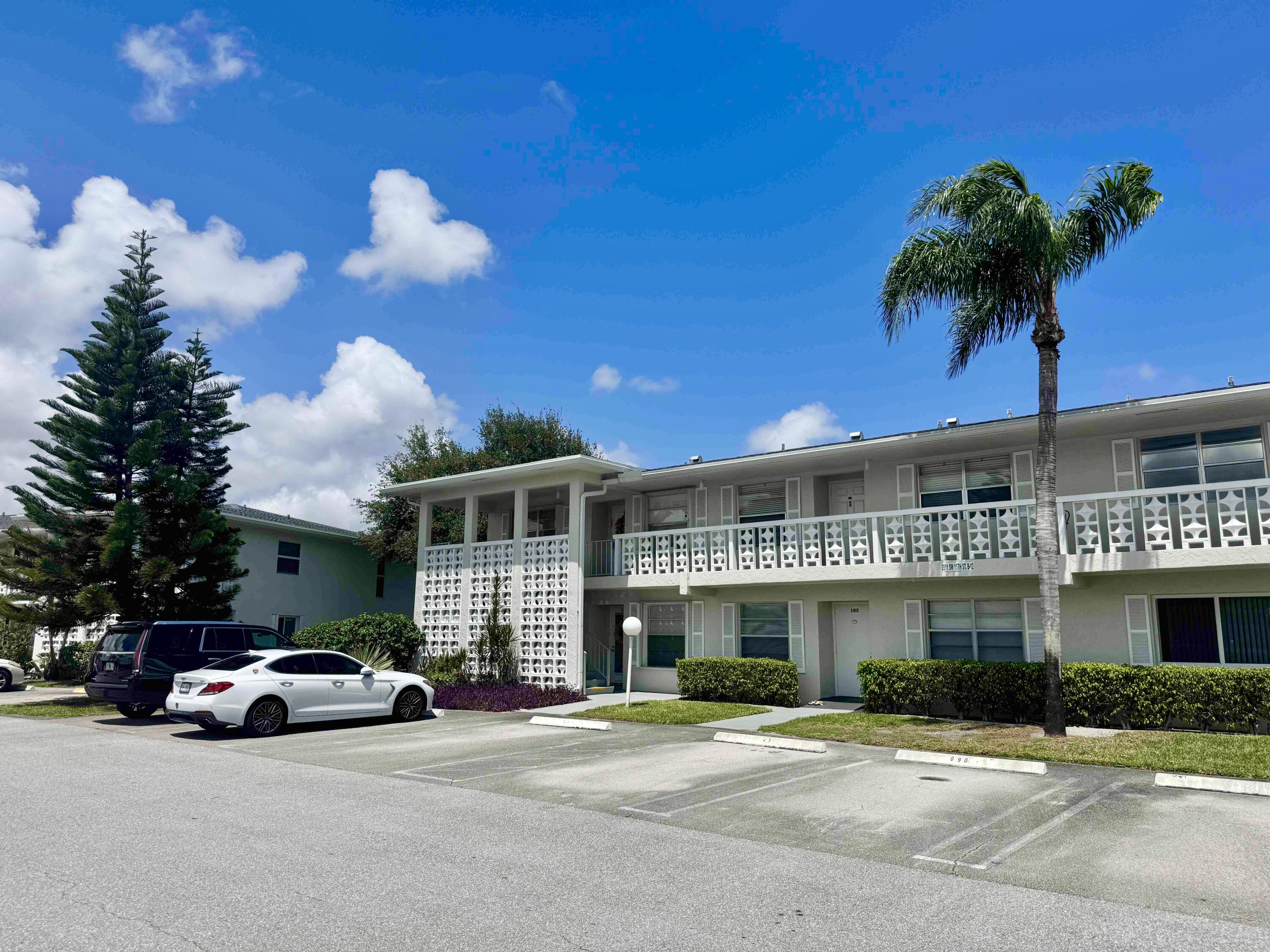 2811 Southwest 15th Street, Unit 202 Delray Beach, FL 33445 - Photo 3 of 21 a view of a building with a street view