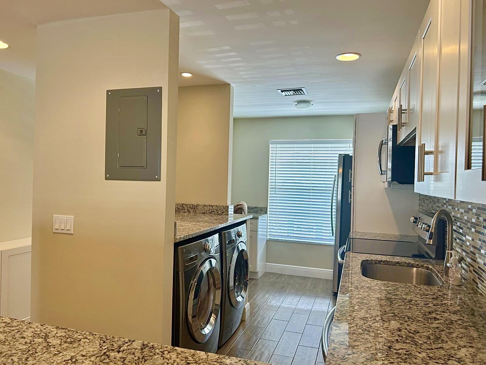 2811 Southwest 15th Street, Unit 202 Delray Beach, FL 33445 - Photo 9 of 21 a bathroom with a sink and a mirror