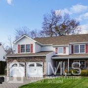 19 Madison Drive Helmetta, NJ 08828 - Photo 2 of 45 a front view of a house with garden